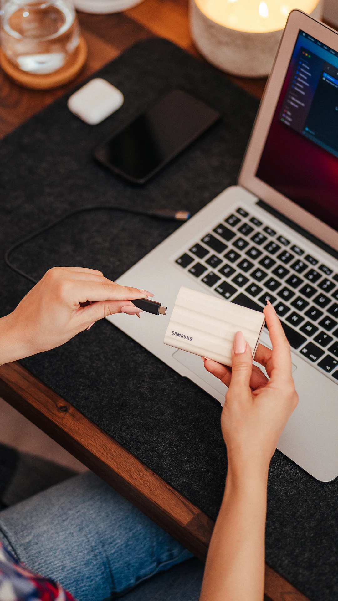 a person's hands on a laptop