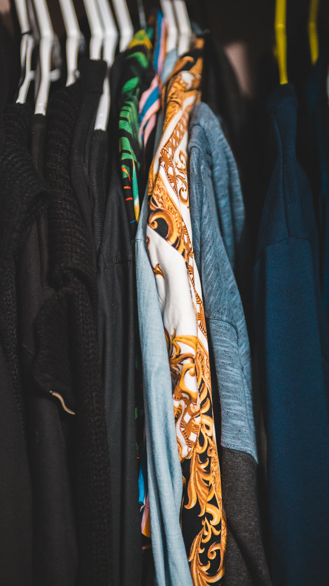 blue and brown clothes in closet