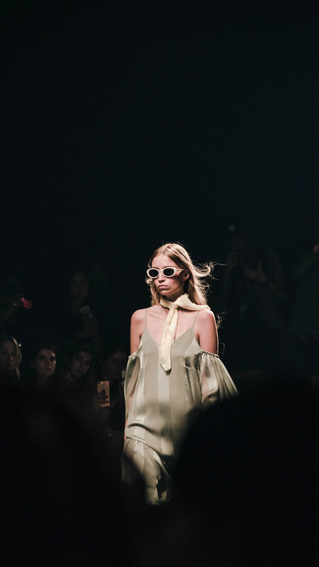 woman in white dress wearing sunglasses