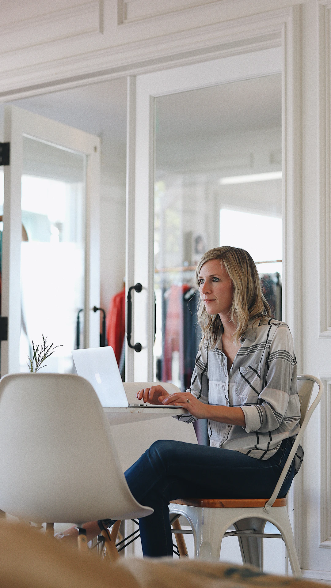 woman in white dress shirt sitting on chair