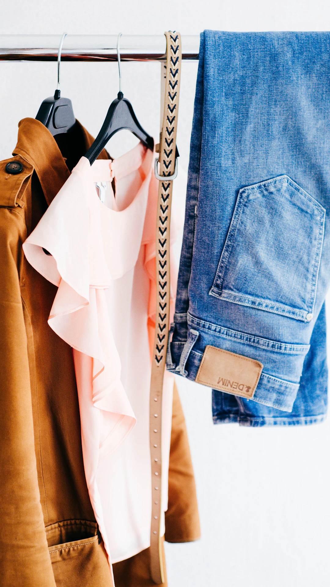 women's four assorted apparel hanged on clothes rack