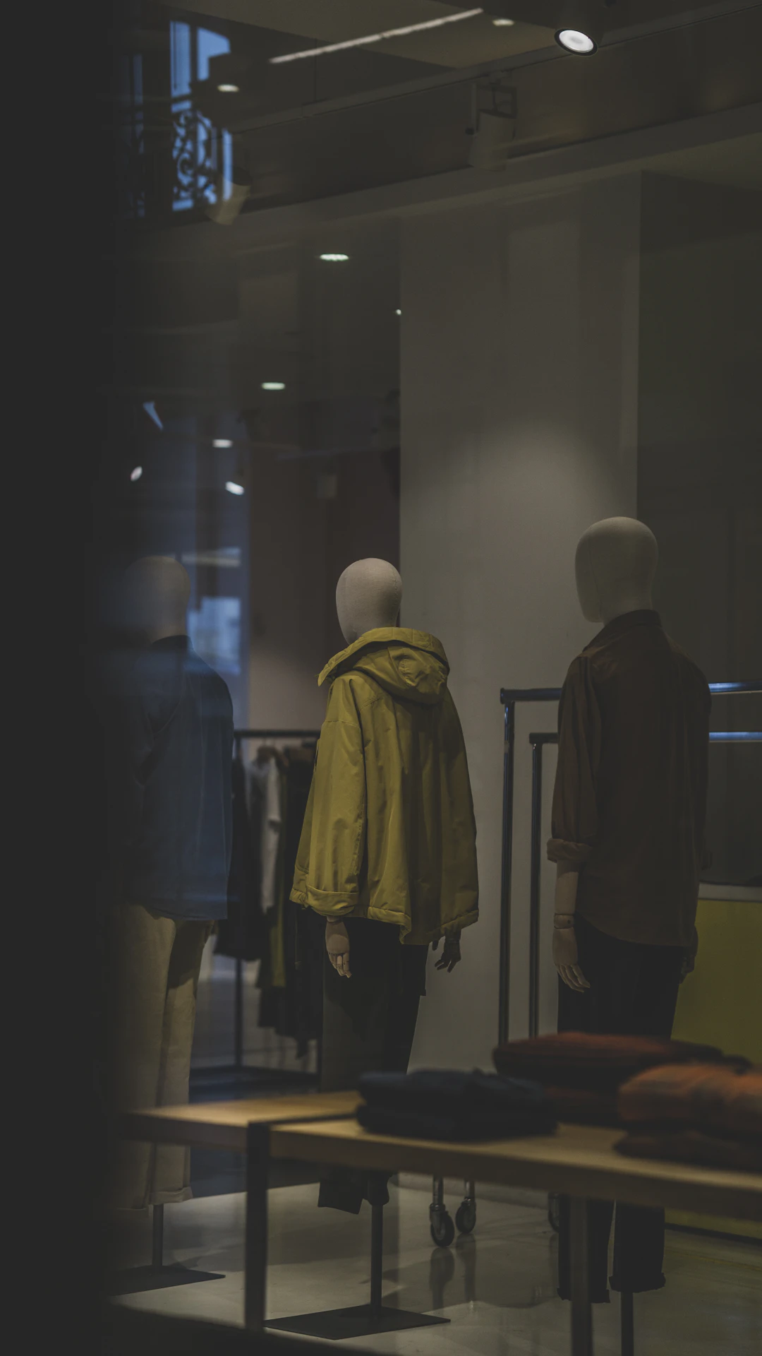 man in black jacket standing beside man in gray jacket