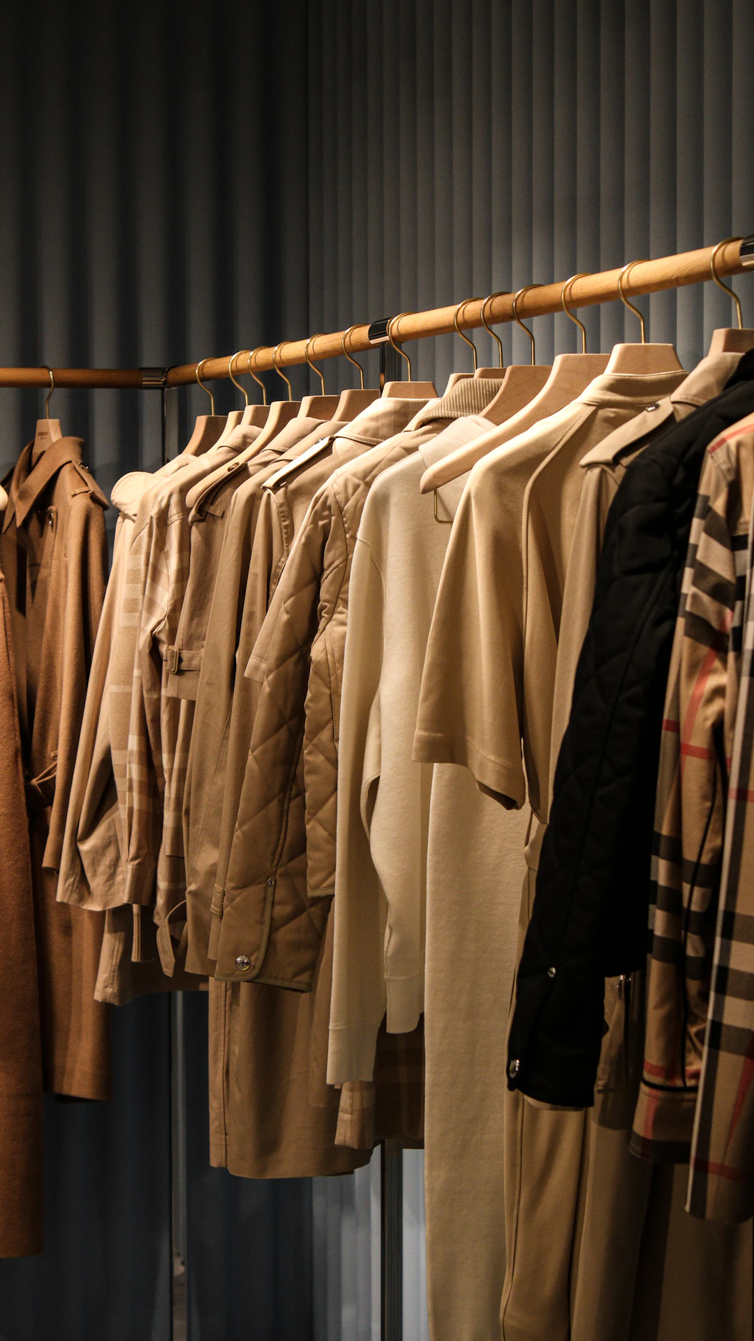 a rack of clothes hanging on a clothes line