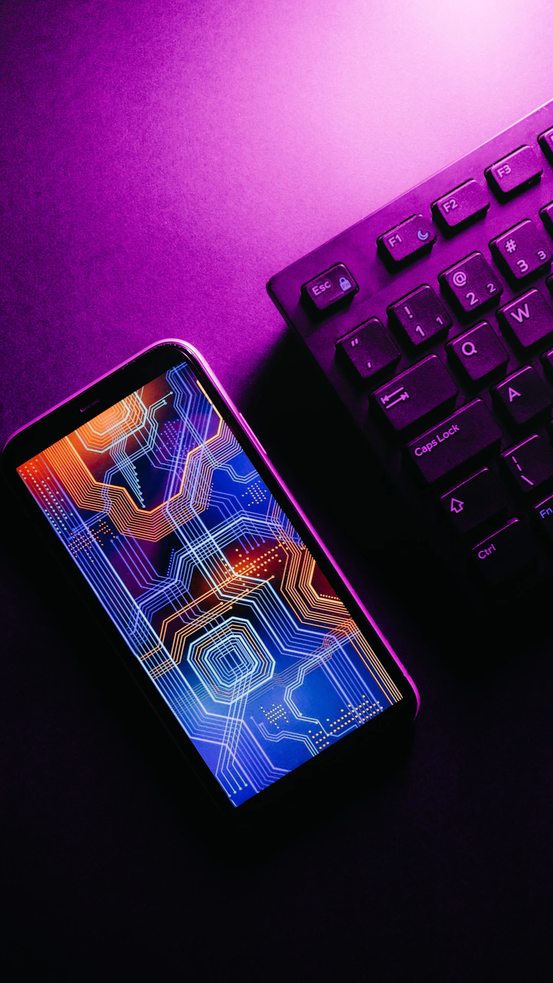 a cell phone on a keyboard