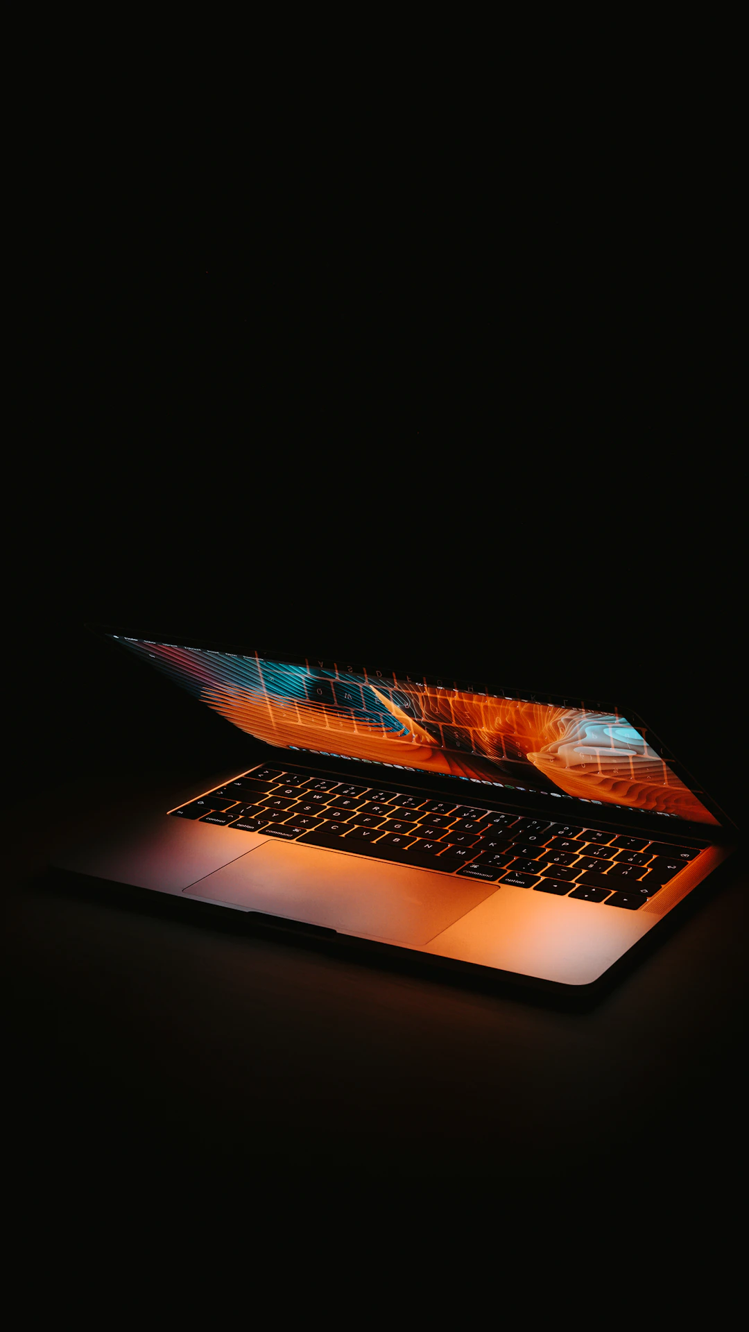 macbook pro on black table